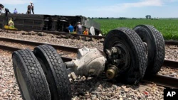 In this photo provided by Dax McDonald, debris lies near train tracks after an Amtrak passenger train derailed near Mendon, Missouri, on June 27, 2022.