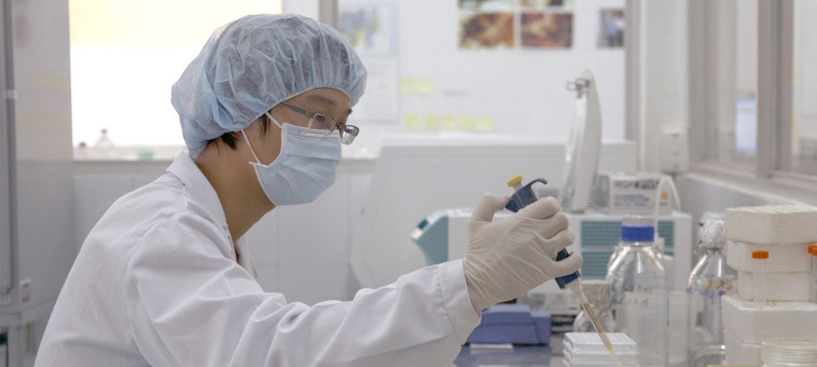 A medical technician does analysis in a laboratory.