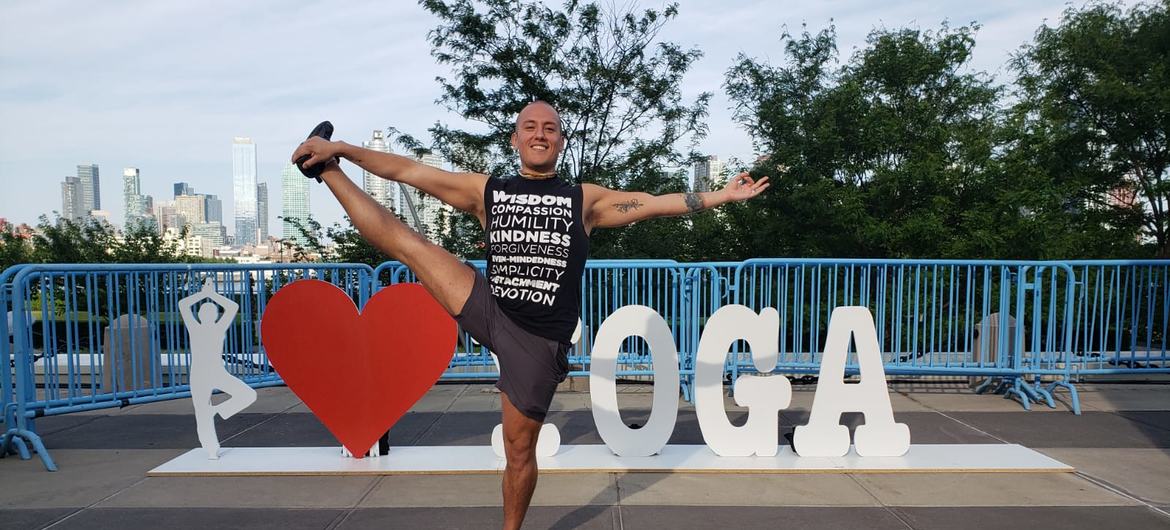 Kishore Chandra, an instructor at the Bhakti Center, demonstrates a pose or asana.