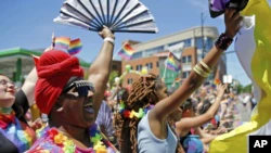 Participants shout during the 51st LGBTQ Pride Parade, Sunday, June 26, 2022, in Chicago.  (AP Photo/Jon Durr)