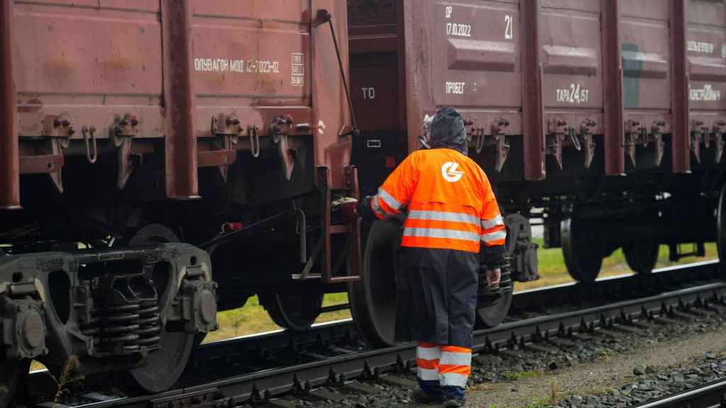 A Lithuanian worker inspects freight cars on a train from the Russian exclave of Kaliningrad.