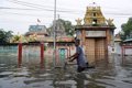 At least 13 dead after a heavy downpour floods a sacred cave in northern India