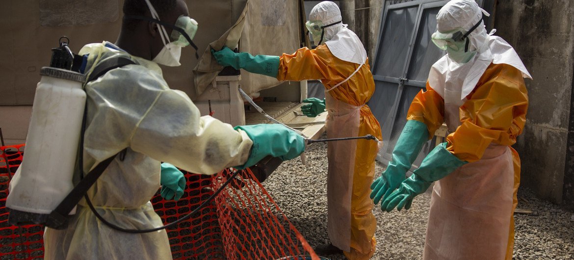 FILE, ARCHIVE.  Health workers in Conakry, Guinea, during the 2015 Ebola outbreak