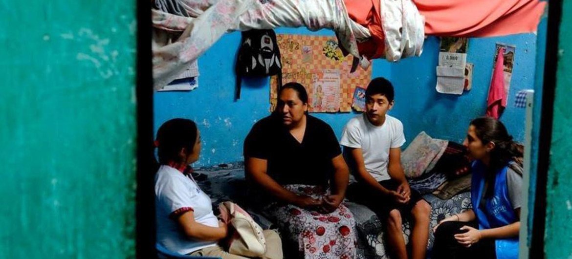 A family tells a UNHCR official how they fled from Honduras to Guatemala to escape gangs.  They now live in Villanueva, Ciudad de Sol, one of the most dangerous places in Guatemala.