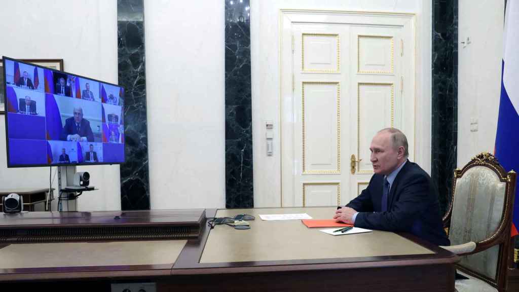 Vladimir Putin in a meeting.