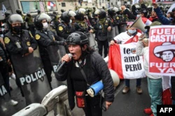 Peruvians protest against the government of President Pedro Castillo during Peru's Independence Day in Lima, on July 28, 2022.