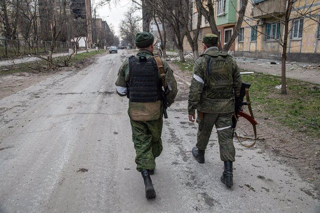 File - Militiamen of the self-proclaimed Donetsk People's Republic in the city of Mariupol, in southeastern Ukraine