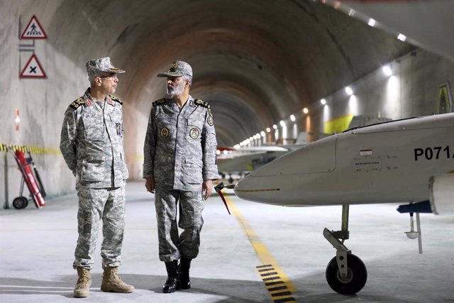 FILE - 28 May 2022, Iran: The Commander-in-Chief of the Iranian Army, Major General Abdolrahim Mousavi, and the Chief of the General Staff of the Armed Forces, Major General Mohammad Bagheri, visit an underground drone base