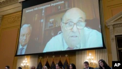 Rudy Giuliani's video statement is shown from a screen as the House select committee investigating the January 6 attack on the US Capitol in hearing on July 12, 2022.