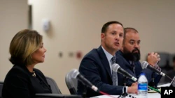 Texas House investigative committee chairman Rep. Dustin Burrows, center, answers questions during a comprehensive report on the Robb Elementary School shootings as the committee meets Sunday, July 17, 2022 at Uvalde, Texas.  (AP Photo/Eric Gay)