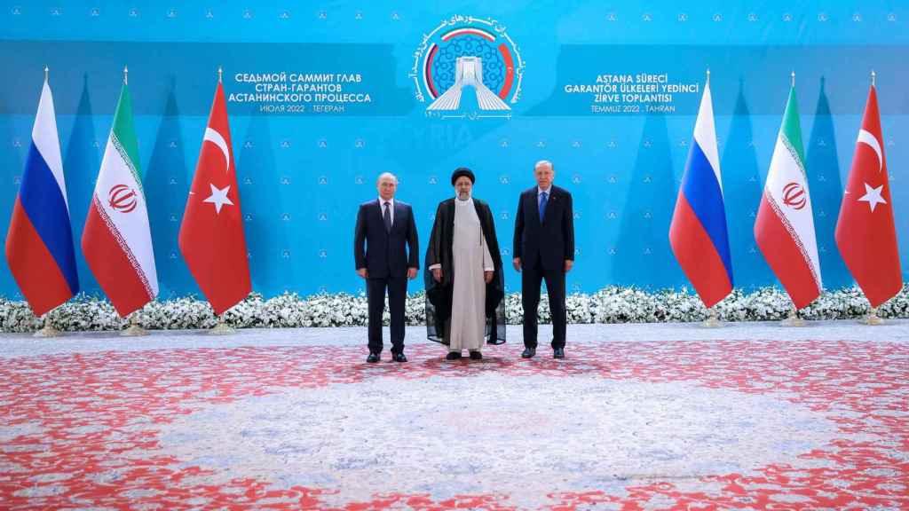 Russian President Vladimir Putin, Turkish President Recep Tayyip Erdogan and Iranian President Ebrahim Raisi meet ahead of a summit of leaders of the Astana process guarantor states.