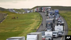 Traffic stalls on Interstate 90 after a fatal crash in which at least 20 vehicles collided near Hardin, Mont., on Friday, July 15, 2022. (Amy Lynn Nelson/The Billings Gazette via AP)