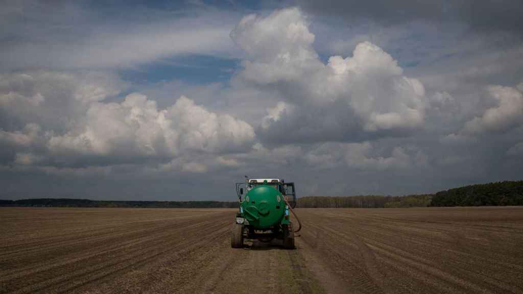 View of a farm field on a road in the outskirts of kyiv.