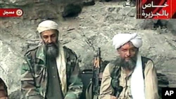 FILE - Osama bin Laden, left, and Ayman al-Zawahiri speak on Al Jazeera television against US attacks on the Taliban regime in Afghanistan, in this image made from video.