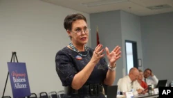 FILE - In this May 16, 2018, file photo, Harriet Hageman addresses a Wyoming Business Alliance meeting in Casper, Wyo.