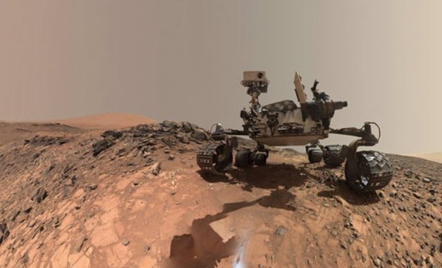 NASA's Curiosity Mars rover took this low-angle self-portrait at the site where it drilled into a rock on July 30, 2015, producing a dust (visible in the foreground) that was later confirmed to contain the rare mineral tridymite.