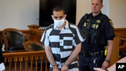 Hadi Matar, 24, center, arrives for an arraignment at the Chautauqua County Courthouse in Mayville, New York, on Saturday, August 13, 2022.