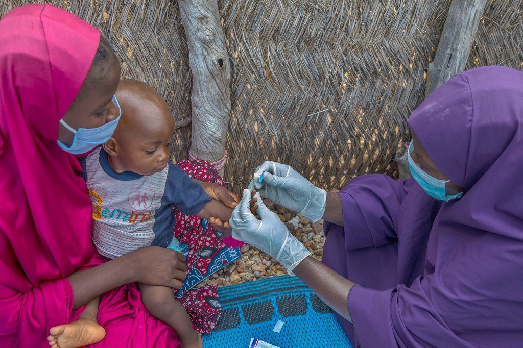 A baby receives a malaria test in Adamawa State, Nigeria.