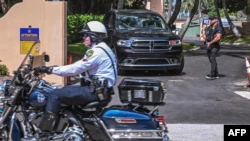 FILE - Secret Service and local law enforcement officers are seen outside former President Donald Trump's home at Mar-A-Lago in Palm Beach, Fla., on Aug. 9, 2022.