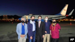 A delegation of US lawmakers pose for a photo after arriving at Songshan Airport in Taipei, Taiwan, Sunday, Aug. 14, 2022. (Taiwan Foreign Ministry via AP)