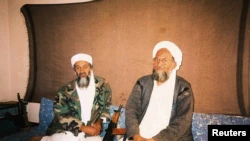 FILE PHOTO: Osama bin Laden with his adviser Ayman al-Zawahiri, during an interview, in this image provided by the Dawn newspaper on November 10, 2001. Hamid Mir /Editor/Ausaf Newspaper for Daily Dawn/via REUTERS