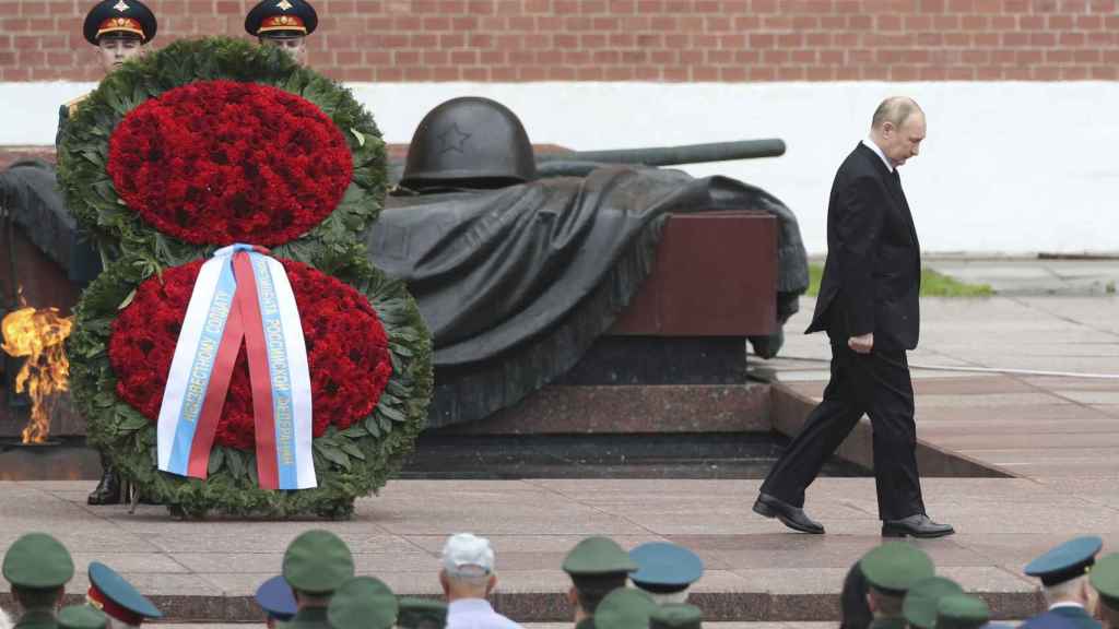 Vladimir Putin attends a ceremony at the Tomb of the Unknown Soldier on June 22 in Moscow.