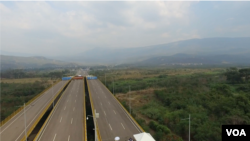 Aerial images show the containers used as barricades on the Simón Bolívar international bridge between Venezuela and Colombia.