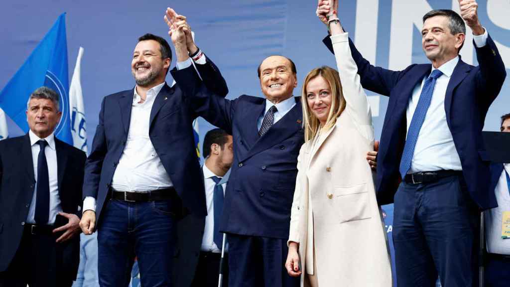 The leader of the Lega (League), Matteo Salvini, the leader of Forza Italia, Silvio Berlusconi, and the leader of the Brothers of Italy, Giorgia Meloni, embrace during the closing rally of the electoral campaign of the coalition of center- right on Piazza del Popolo,.