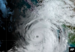 This satellite image provided by NOAA shows Hurricane Kay off the Pacific coast of Mexico, early Wednesday, September 7, 2022. Kay's maximum sustained winds increased to 100 mph on Wednesday, and forecasters say it could graze the middle part of the peninsula this week.  .  (NOAA via AP)