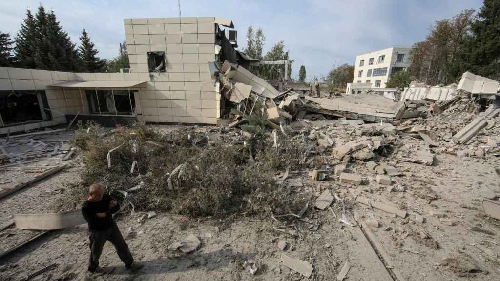 A citizen walks through the rubble in Kherson.