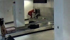 Man arrested for climbing airport baggage carousel