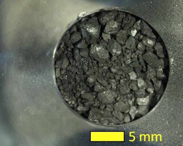 Receiving camera sample A from the first landing of the Hayabusa2 spacecraft, captured by an optical microscope.