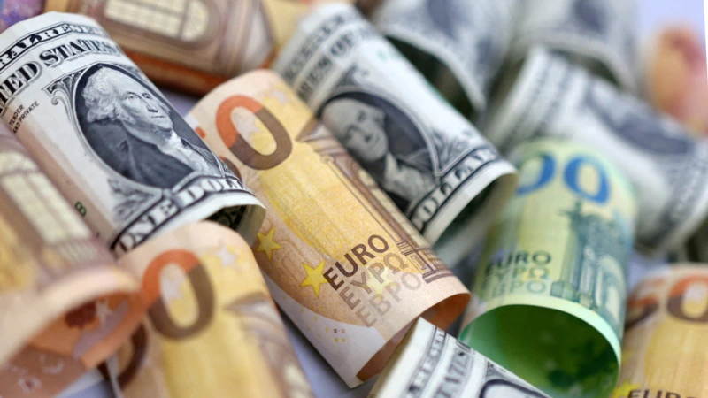 The euro sinks below the dollar to a new 20-year low