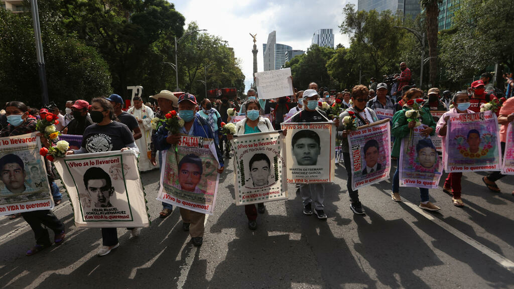 Thousands of people march to demand the truth about the disappearance of the Ayotzinapa students