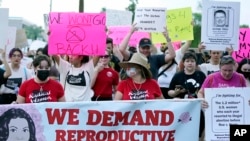 Protesters march around the Arizona Capitol after the Supreme Court's decision to overturn the landmark Roe v.  Wade on June 24, 2022, in Phoenix.