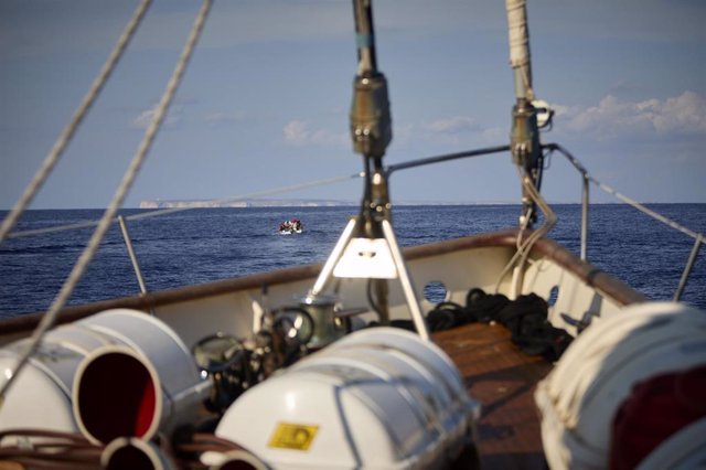 Archive - The ship 'Astral', from the NGO Open Arms, approaches a small fishing boat carrying migrants from Chebba (Tunisia), in the Mediterranean Sea