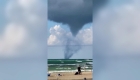 Watch a waterspout form over a Canadian lake