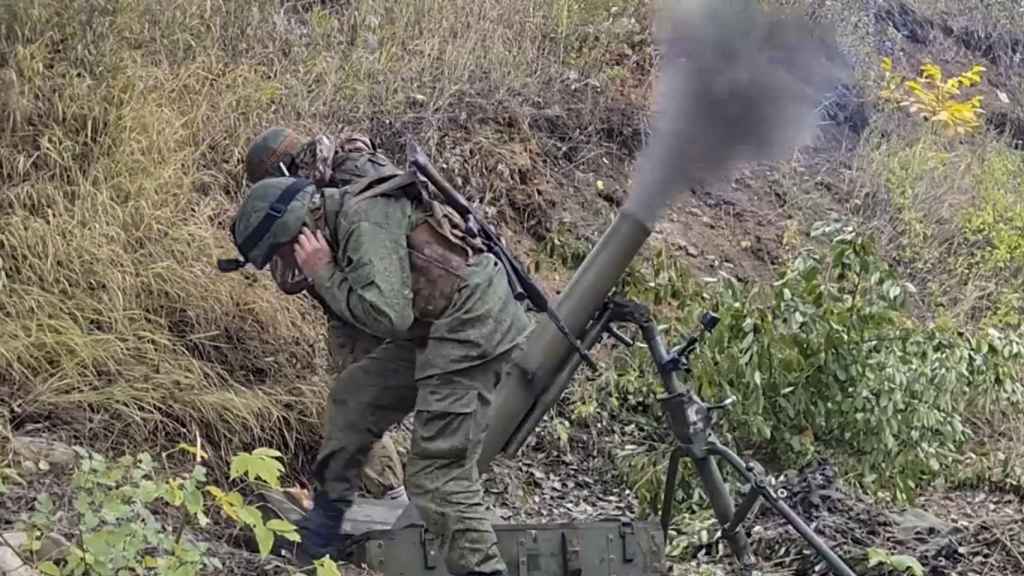 The self-proclaimed militia of the Donetsk Republic firing weapons in the Donetsk region.