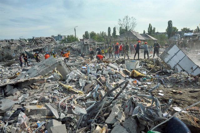 Health services work to remove debris after an attack in Zaporizhia