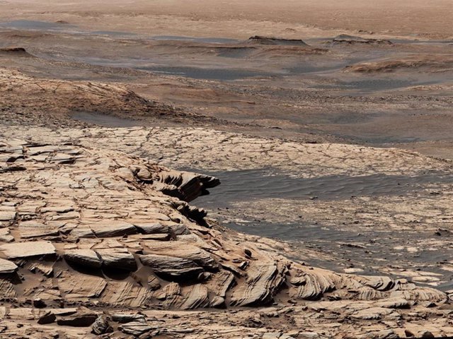 Stitched together from 28 images, this view from NASA's Curiosity Mars rover was captured after the rover climbed the steep slope of a geological feature called "Greenheugh Pediment".