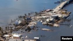 Destroyed homes and businesses on Pine Island, Florida, are seen from a US Army National Guard Blackhawk helicopter as US National Guard Bureau Chief General Daniel Hokanson tours the area by air after Hurricane Ian caused widespread destruction.  October 1, 2022.