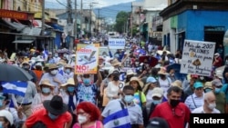 People take part in a protest against El Salvador's President Nayib Bukele in San Salvador, El Salvador, on September 15, 2022.