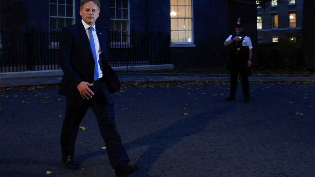 British Secretary of State for the Home Department Grant Shapps walks outside 10 Downing Street.