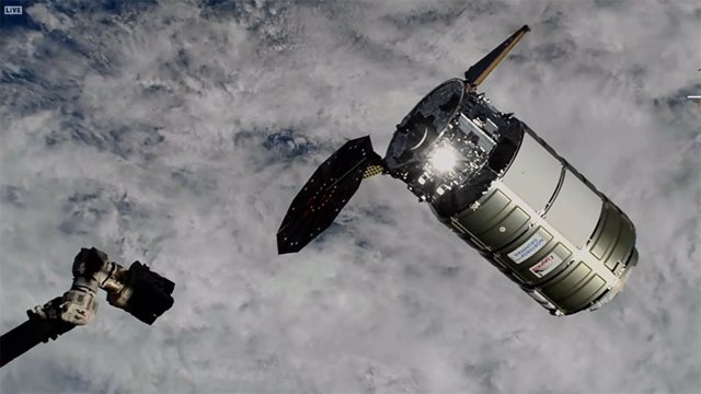 Cygnus spacecraft arriving at the ISS with a single solar panel deployed