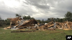 Scenes of devastation are visible in all directions along Lamar County Road 35940, west of State Highway 271, after a massive tornado ripped through the area, causing extensive damage and destroying an unknown number of homes, on Friday, 4 November 2022 in Powderly, Texas.  .  (Jeff Forward/The Paris News via AP)