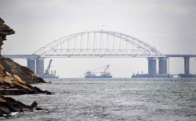 Merchant ship passing under the Kerch Strait Bridge in Uncrania