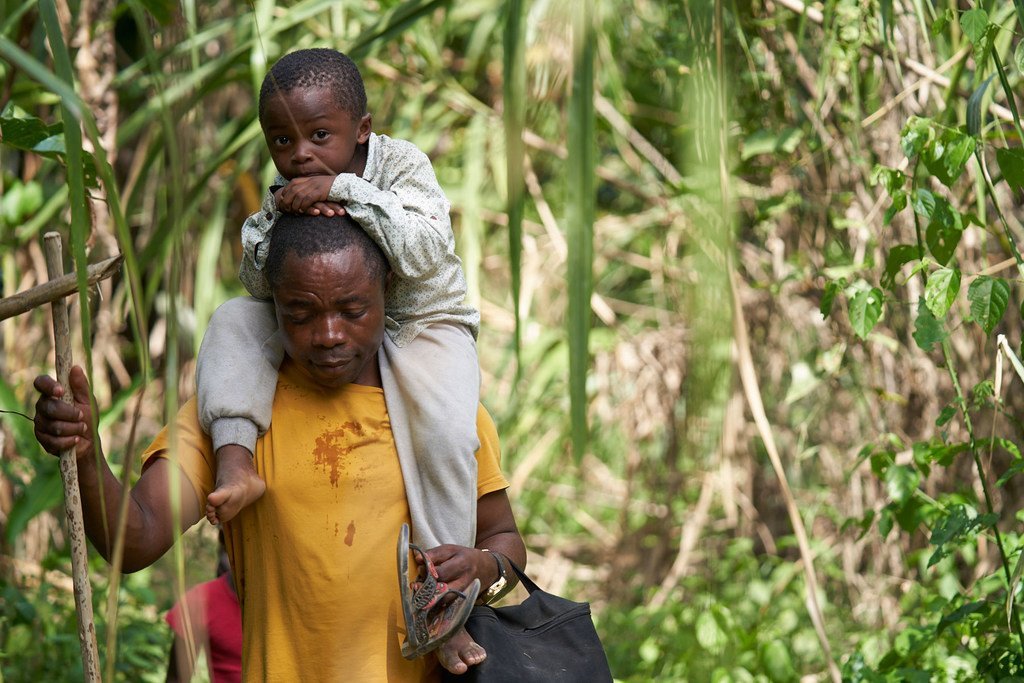 Romeu Mauricio and his three-year-old son, Jetfro cross the Darién, which divides Colombia and Panama