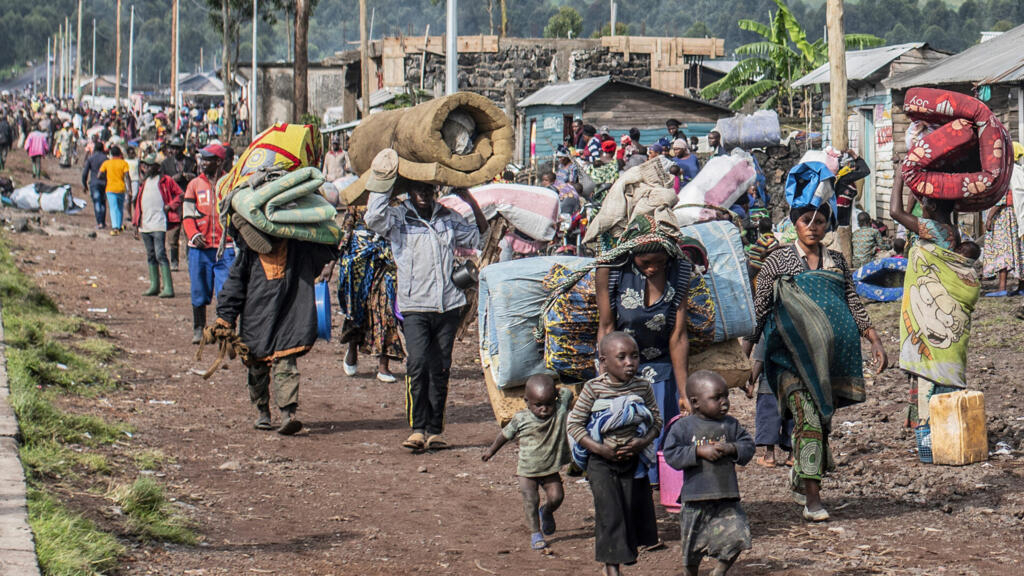 Overcrowded in a camp for displaced people after escaping the massacre in the DRC