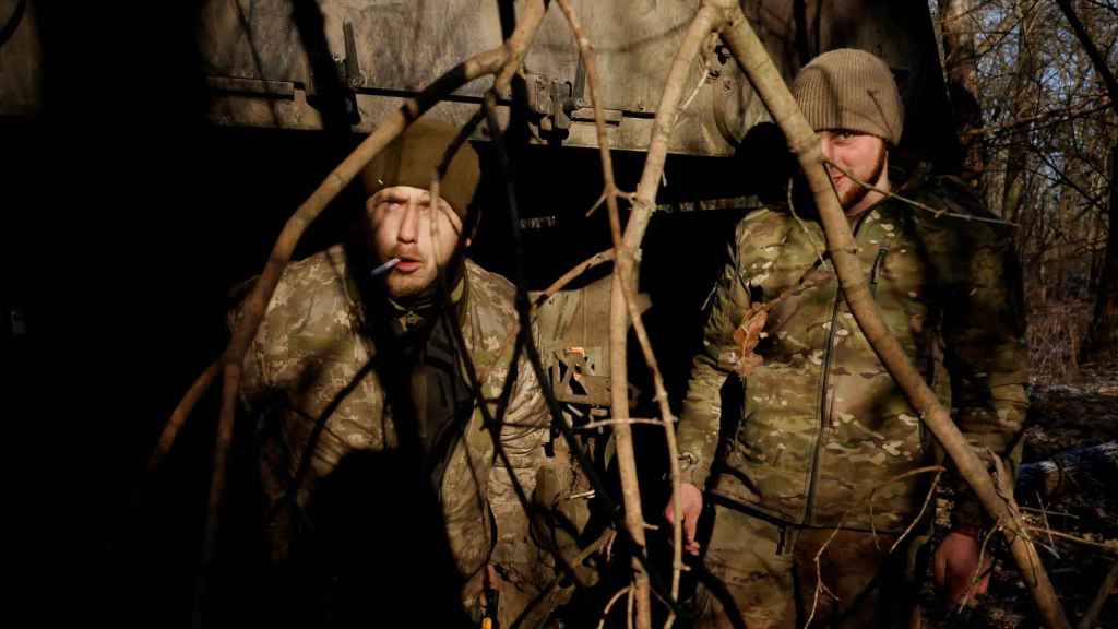 Ukrainian serviceman Hryhorii, 42, of the 43rd Heavy Artillery Brigade emerges from a German Panzerhaubitze 2000 howitzer, as Russia's attack on Ukraine continues, near Soledar.