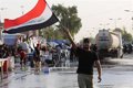 Demonstrators take to the streets in Iraq to protest the devaluation of the Iraqi dinar against the dollar